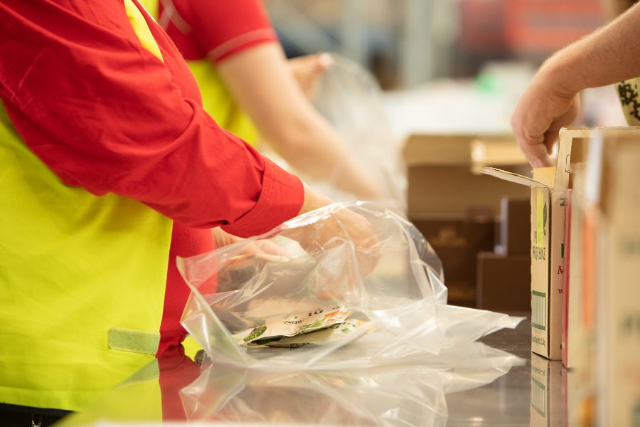 Volunteer packing food